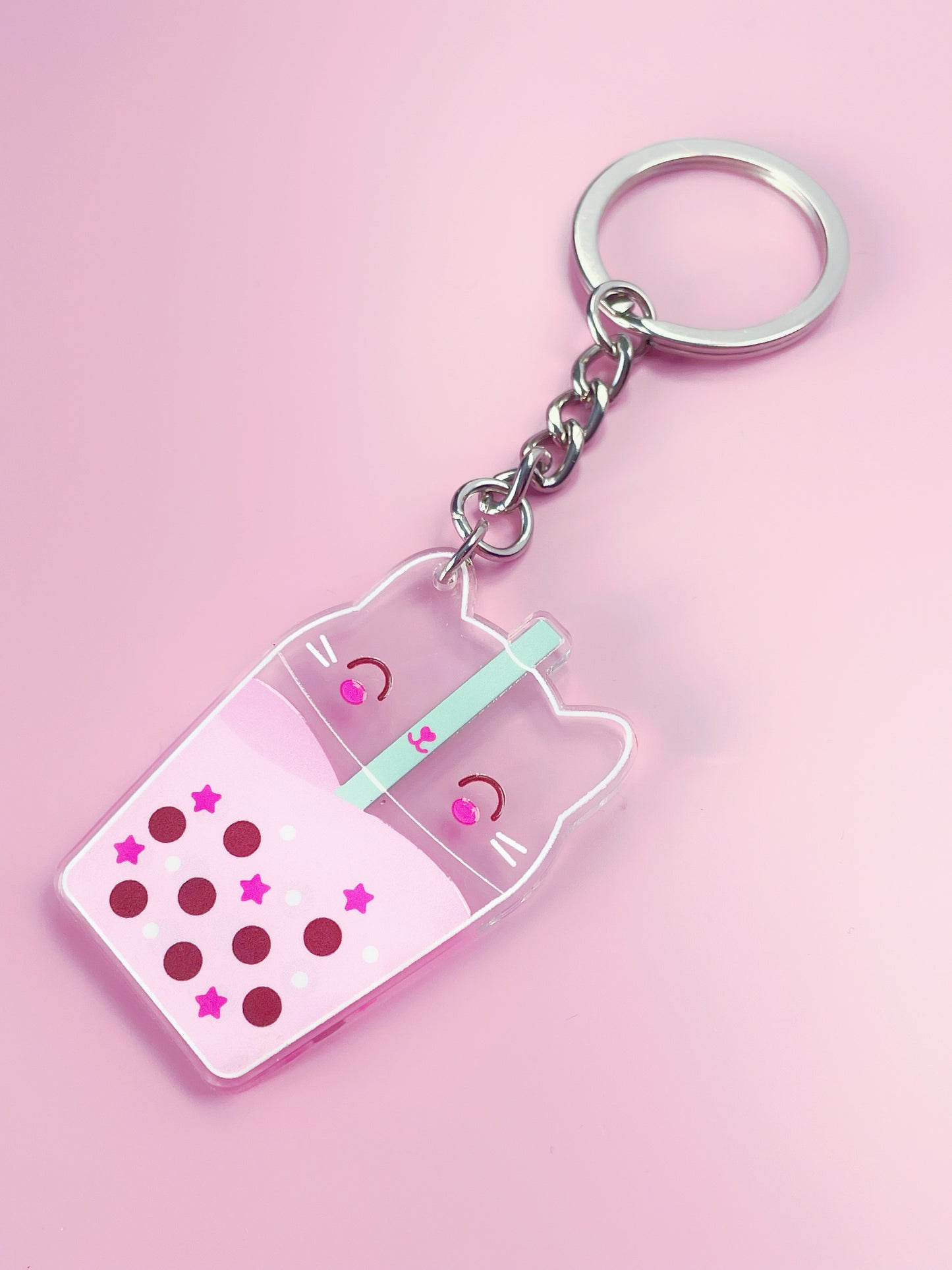 Kawaii pink acrylic keyring featuring a double-sided design of a cute cat bubble tea, perfect for cat lovers and kawaii enthusiasts.