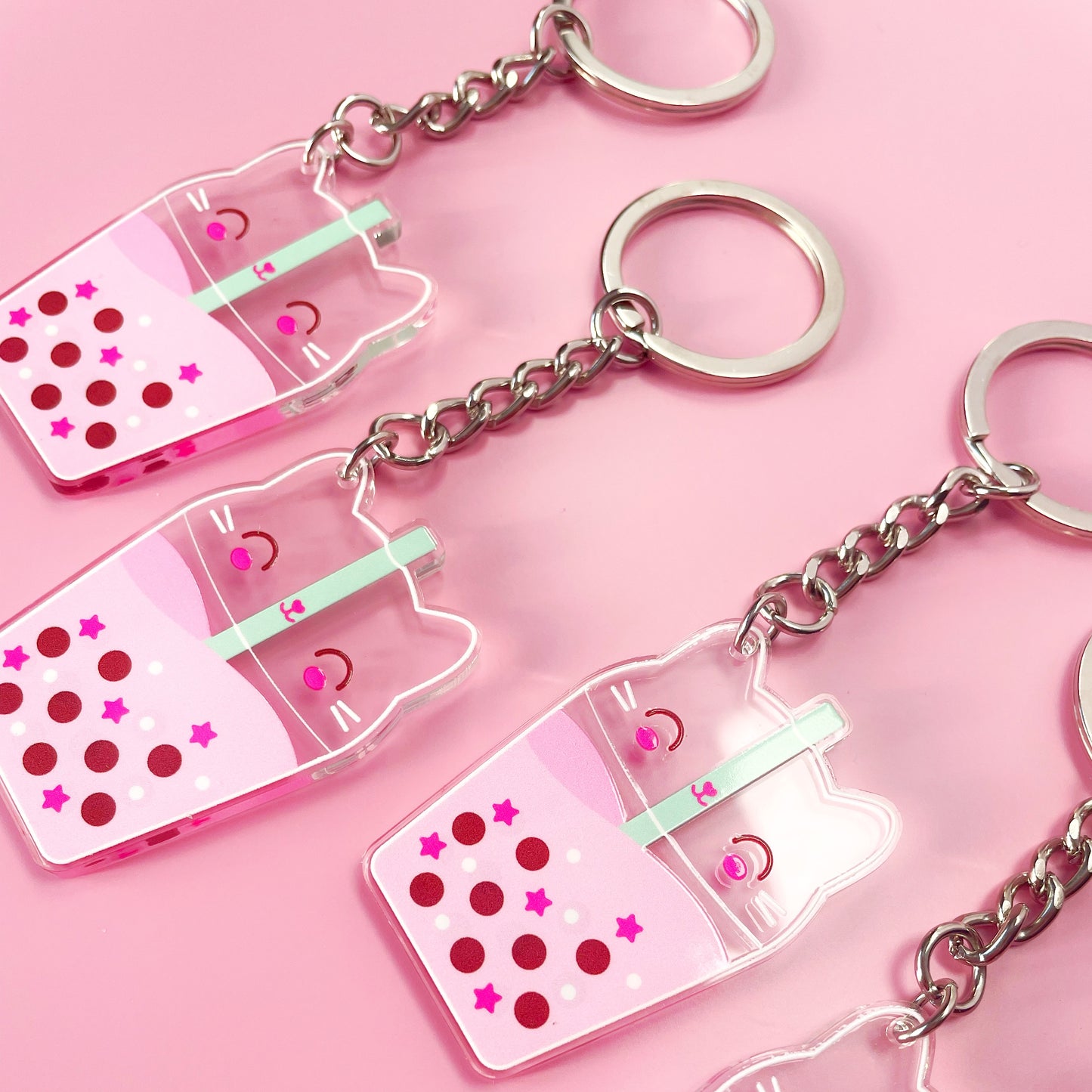 Kawaii cat bubble tea keyring made from durable acrylic, showcasing a playful double-sided design for cat and kawaii lovers