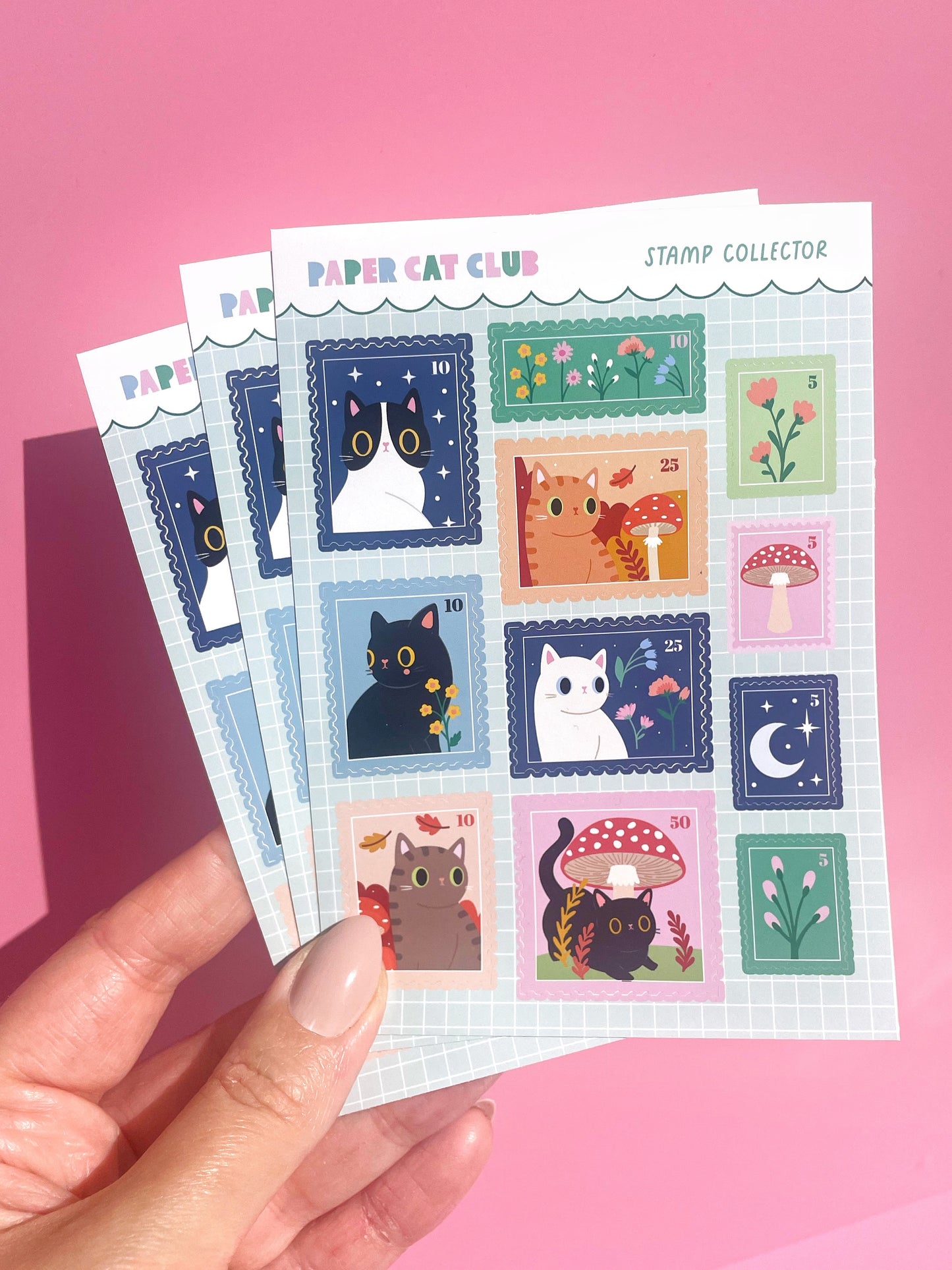 A cute A6 sticker sheet featuring playful cats in stamp designs, perfect for bullet journaling, scrapbooking, and planners.