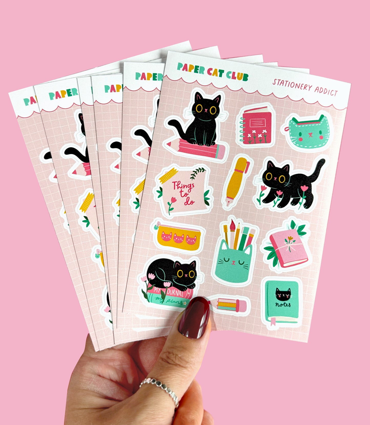 Kawaii cat stickers for planners and journals, featuring little cats with pens, books, and notebooks.