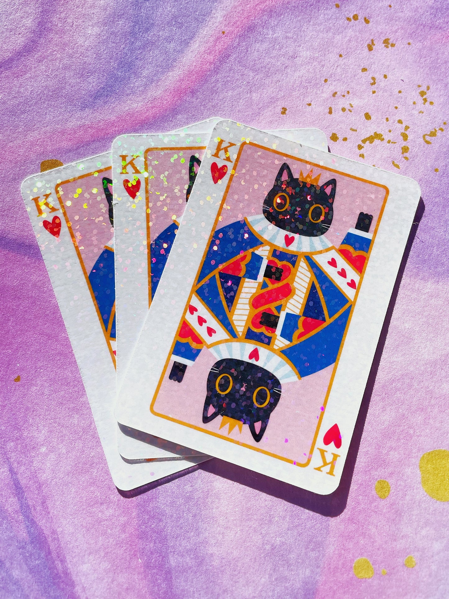 Holographic King of Hearts cat-themed vinyl sticker with a cute heart design, perfect for laptops, water bottles, and journals.