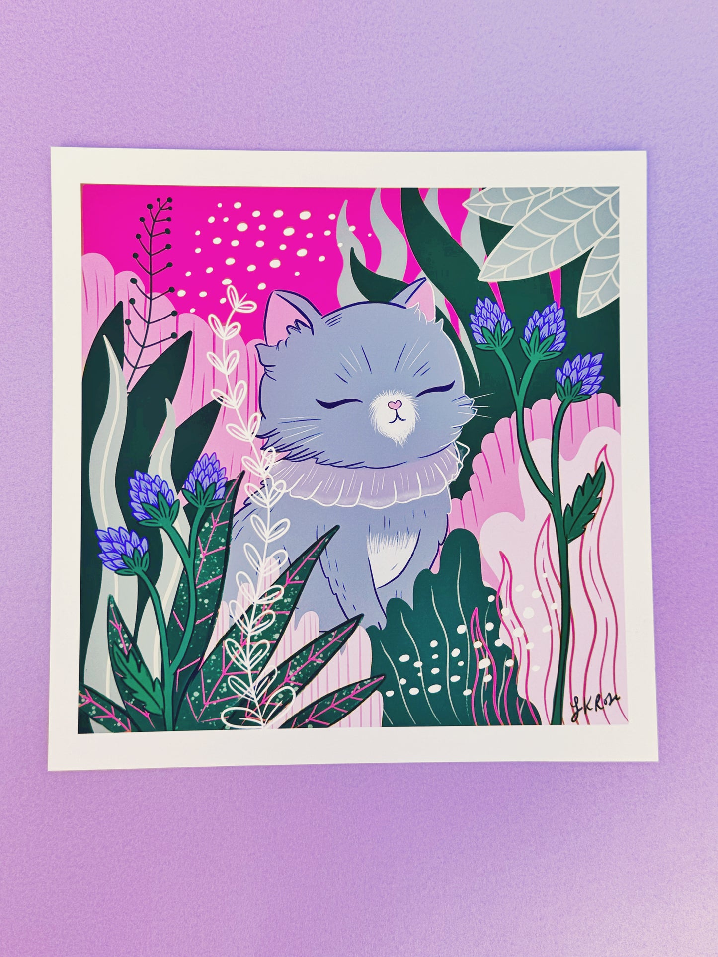 Serene grey cat art print - a cute grey kitty sitting calmly in the forest with pink and green hues.