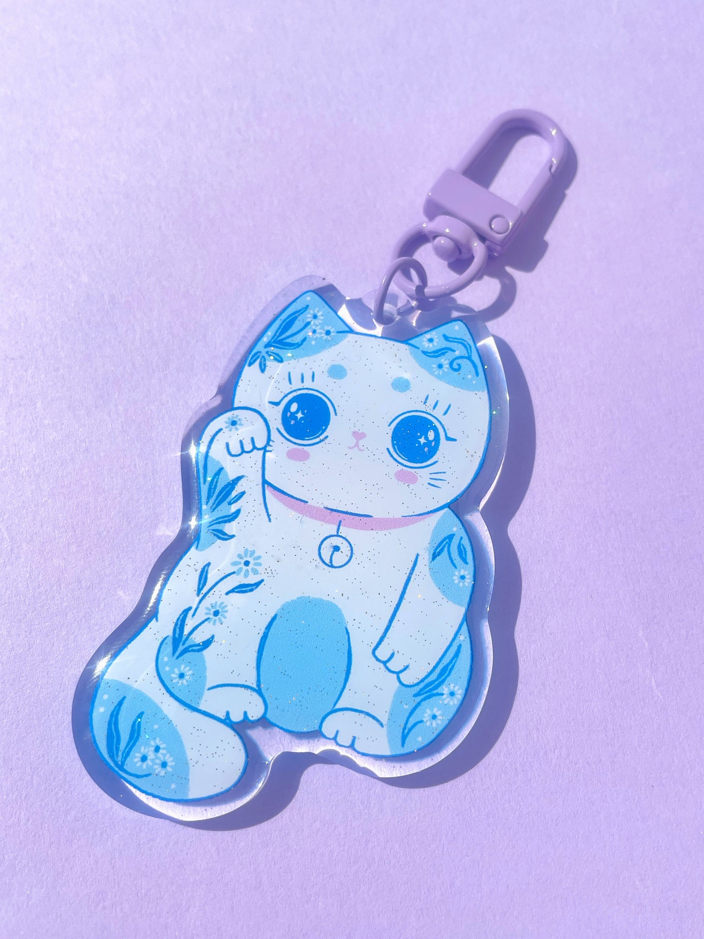 Shiny glittery lucky cat acrylic keyring, a playful charm to attract good luck and add sparkle to your keys.