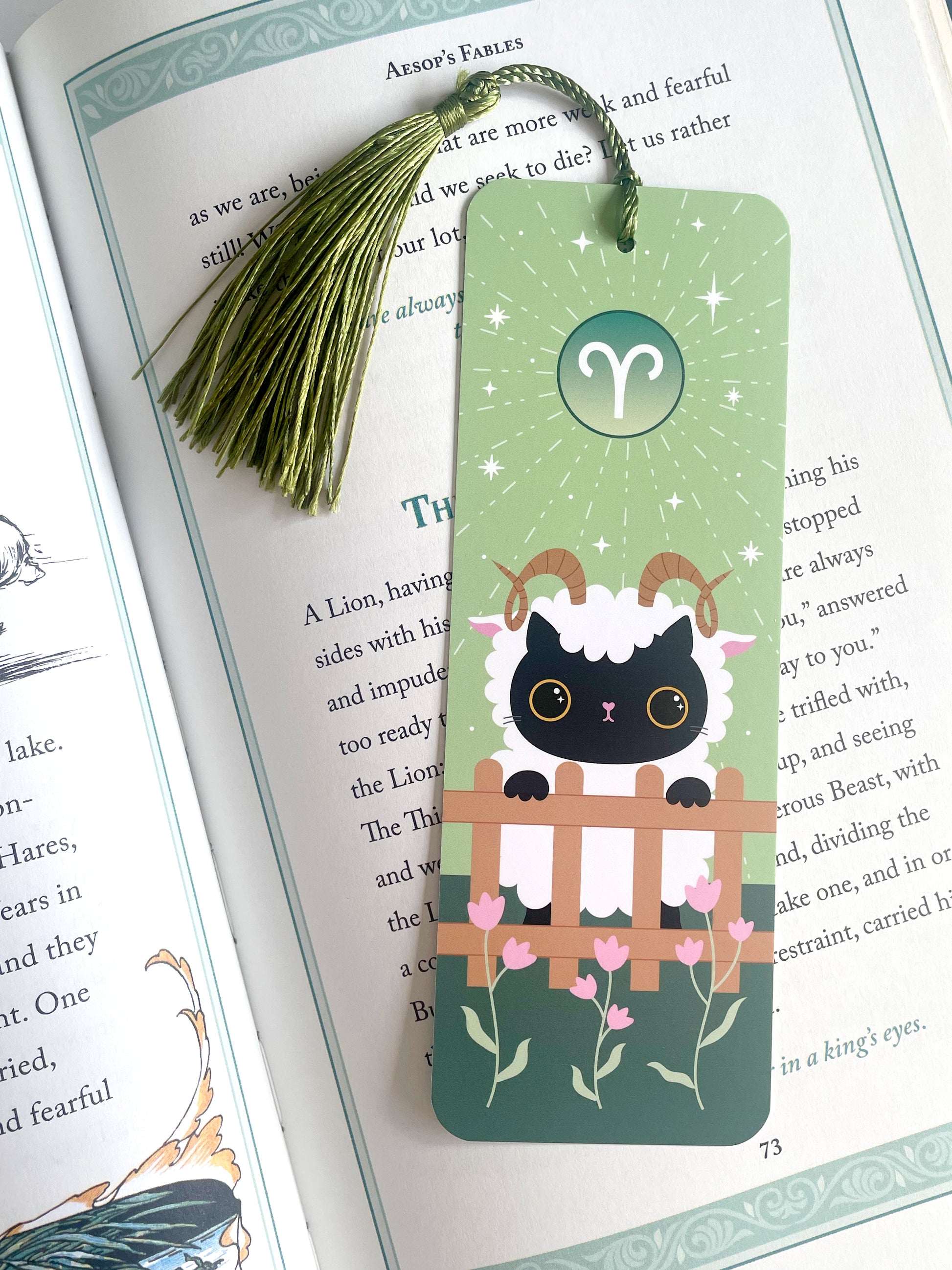 Aries star sign bookmark - cat dressed up as a ram - kawaii srtyle - bookmark inside a book