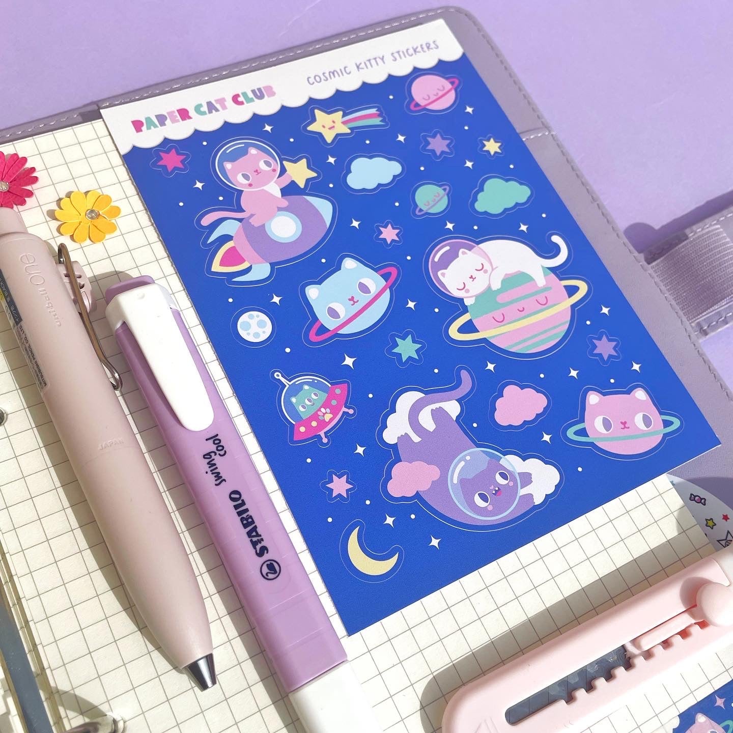 Kawaii space kitty planner sticker sheet with celestial cat and star designs, perfect for decorating dream journals and planners.